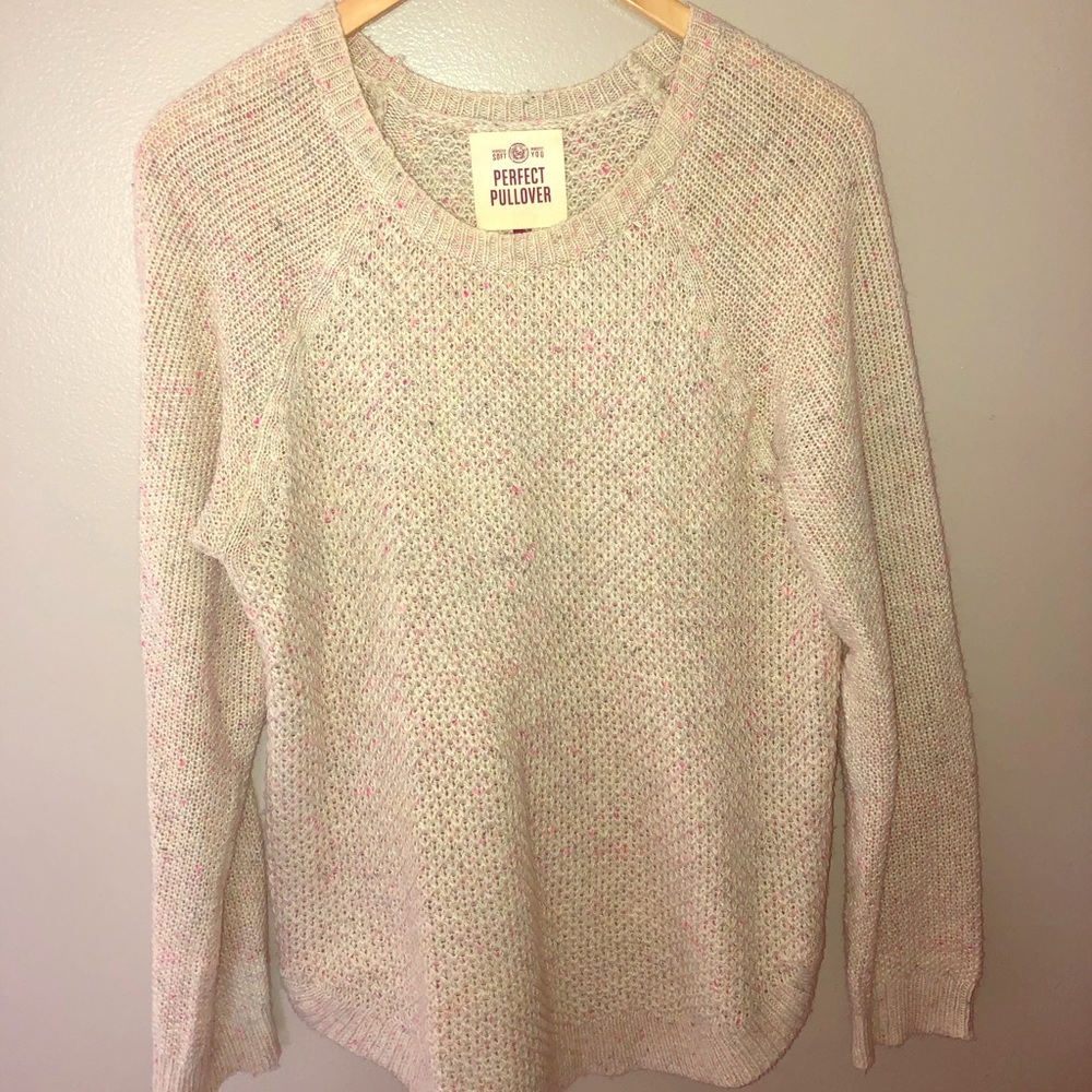 Cream sweater with bits of color throughout.